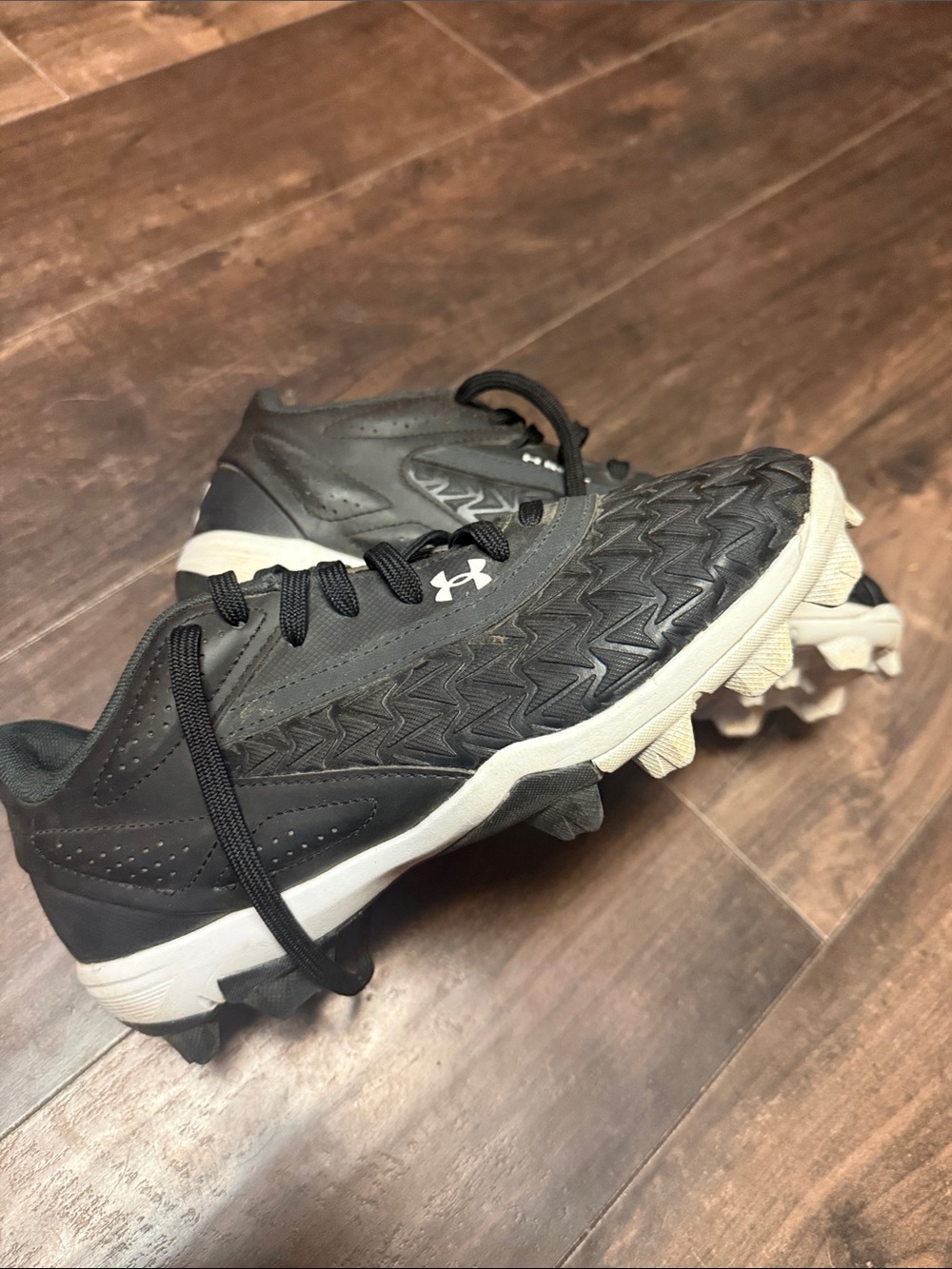 Under Armour Kids Black and White Athletic Cleats